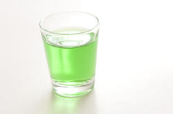 10426   Shot glass filled with absinthe