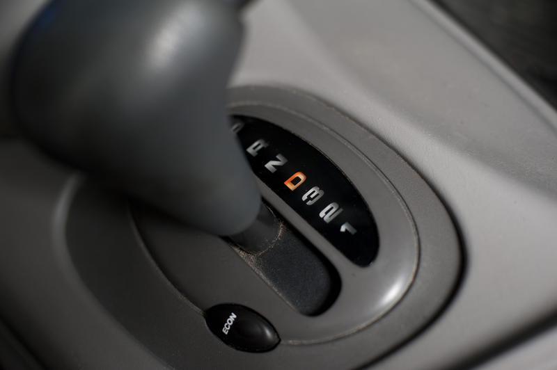 Automatic gearbox in a car with a high angle view of the gear shift in gear icons