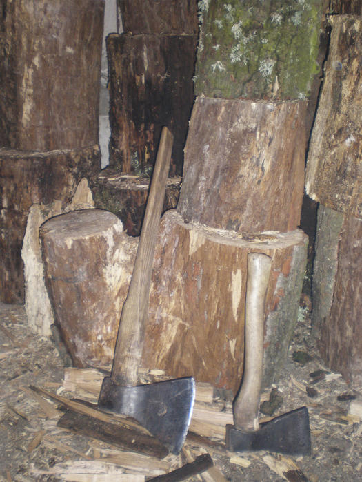 <p>a big and smoller axe,axes,fire wood </p>