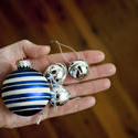 11697   Man holding silver bells and a Christmas bauble