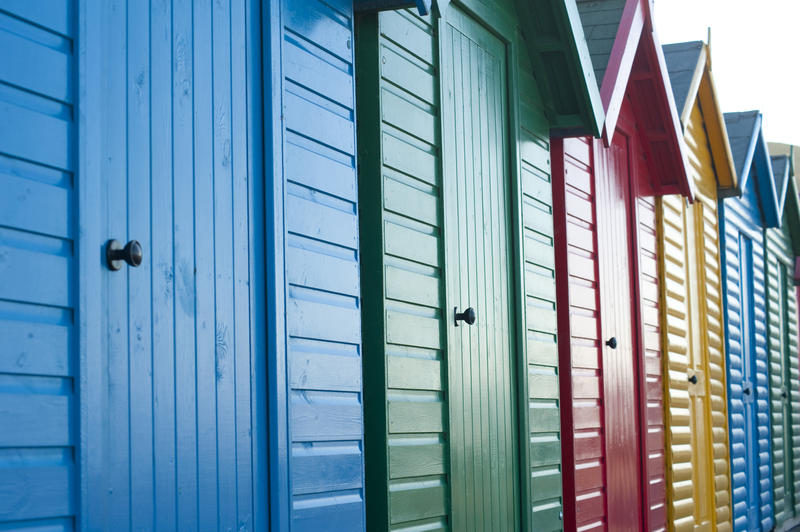 Detail of traditionally British brightly painted wooden beach huts. Whitby, North Yorkshire, UK.