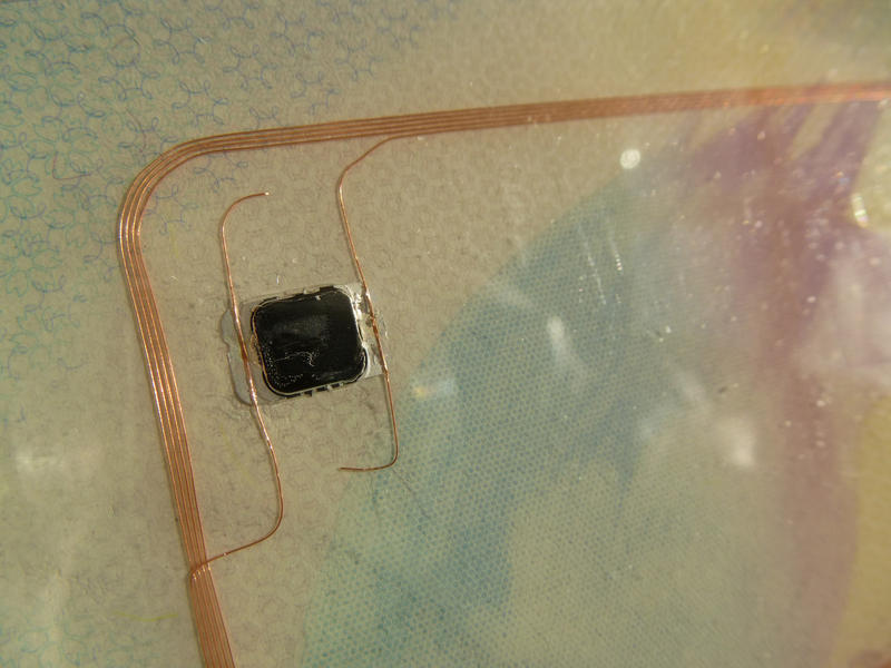 chip embedded into a biometric passport with antenna loop