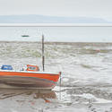 7744   Small fishing boat at low tide