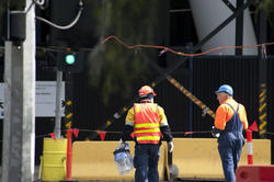 10783   Two workmen at a building site