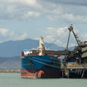 10787   Freighter being offloaded at a cargo wharf