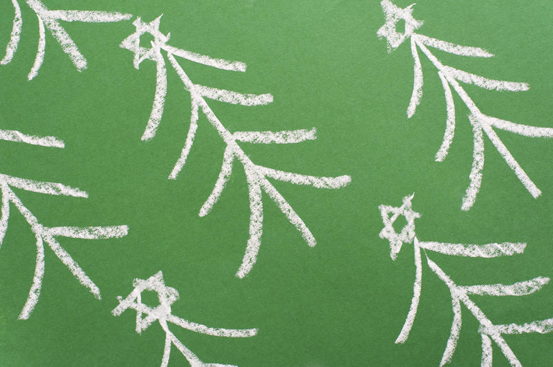 Hand-drawn chalk Christmas tree background pattern decorated with stars in a diagonal orientation on a green chalkboard