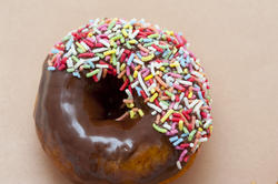 10399   Delicious fresh chocolate donut with sprinkles