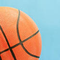 10983   Close up Basketball Ball on a Sky Blue Background