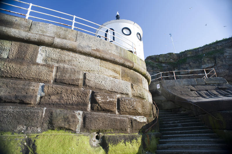 Low angle view of a large block sea wall at whitby