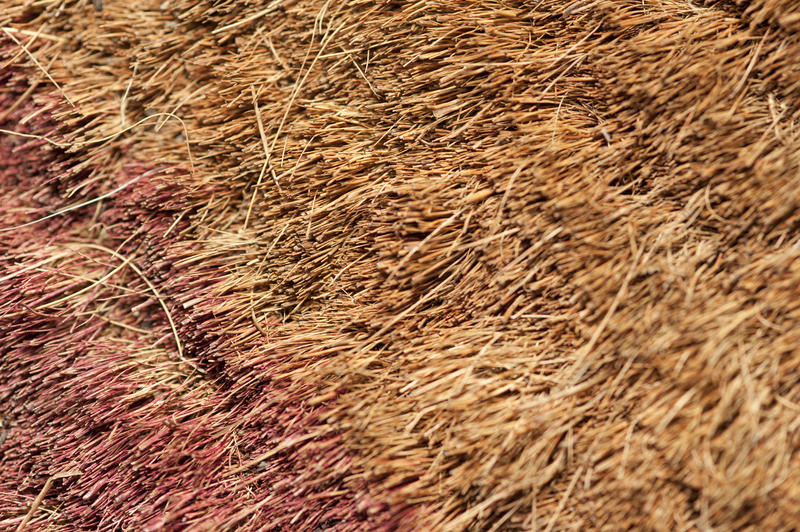 Background texture of a rough coir mat made from the fibres on the husk of a coconut