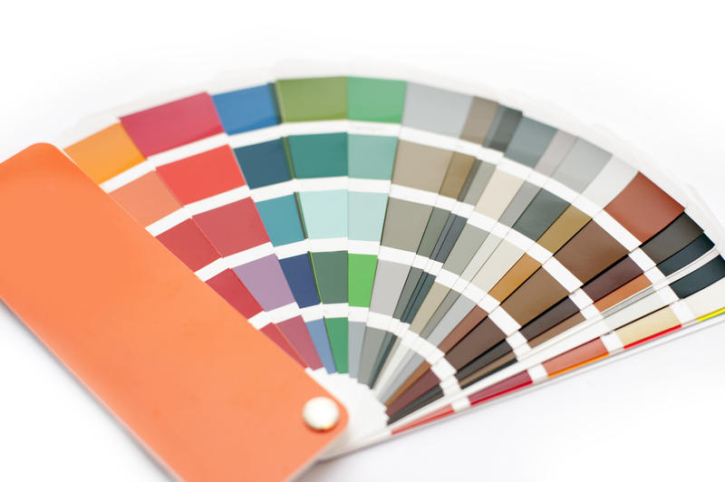 Opened color chart for interior decorating or typography displayed fanned on a white background in a DIY and renovation concept