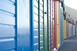 8063   Coloured beach huts on Whitby West Cliff