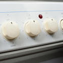 8411   Row of control knobs on a stove