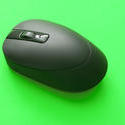 stock image 10800   Black Cordless Computer Mouse on Green Background