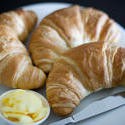 8457   Three golden flaky croissants