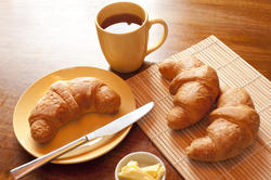 10252   Breakfast with croissants, butter and a cup of tea