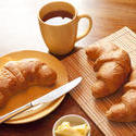 10252   Breakfast with croissants, butter and a cup of tea