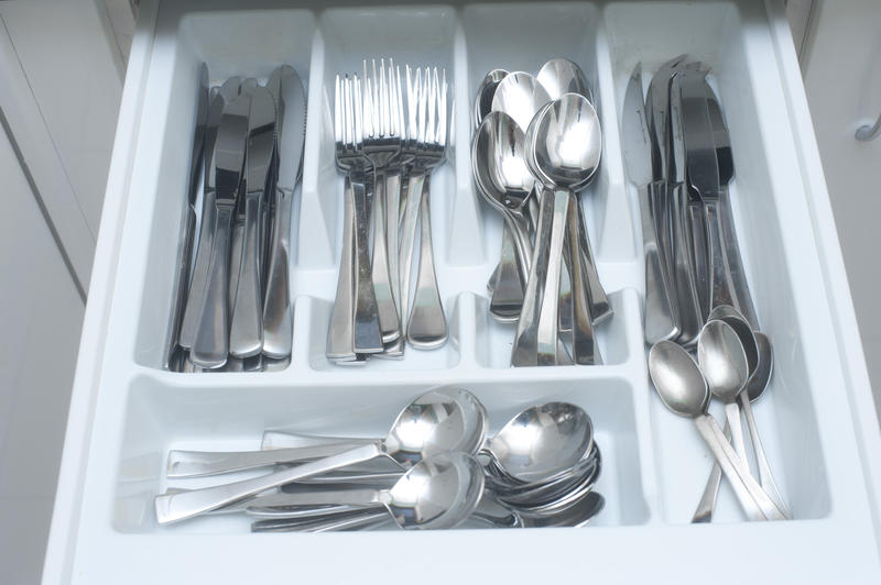 a drawer full of eating utensils spoons knives and forks