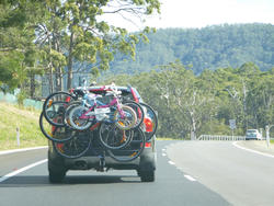 10985   Vehicle driving on a road with a cycle carrier
