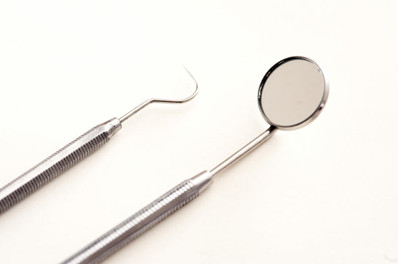 Still Life of Dentist Tools on White Background - High Angle View of Dental Pick and Mirror