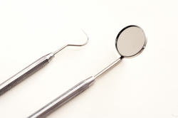 11543   Dental Pick and Mirror on White Background