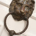 10636   Bronze door knocker in the shape of a lions head