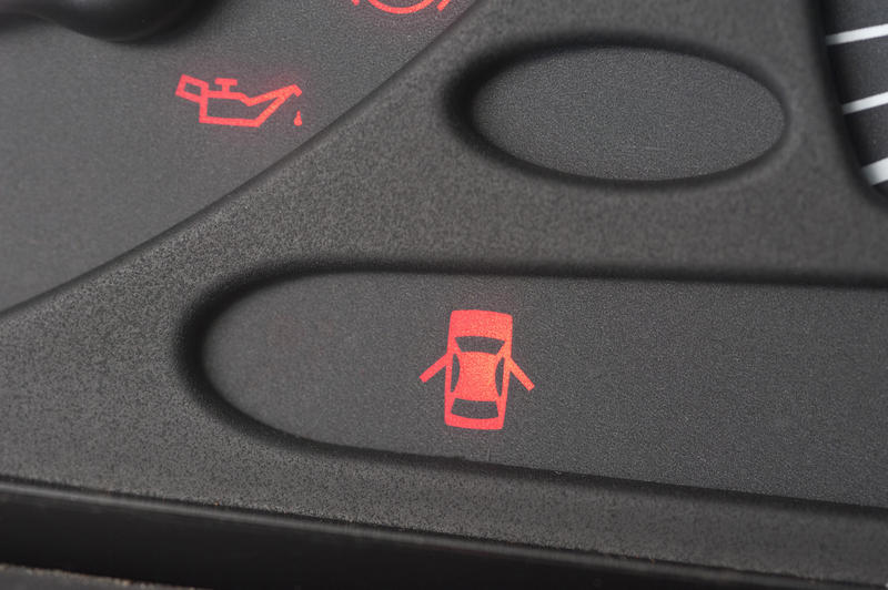 Close up Door Warning Light on the Black Interior Wall of a Car or Vehicle