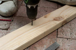 10165   Drilling a hole in wood with a power drill