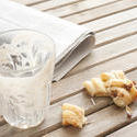 11616   Remnants of Coffee Break on Table with Newspaper