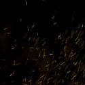8873   Glowing fiery embers flying through the air