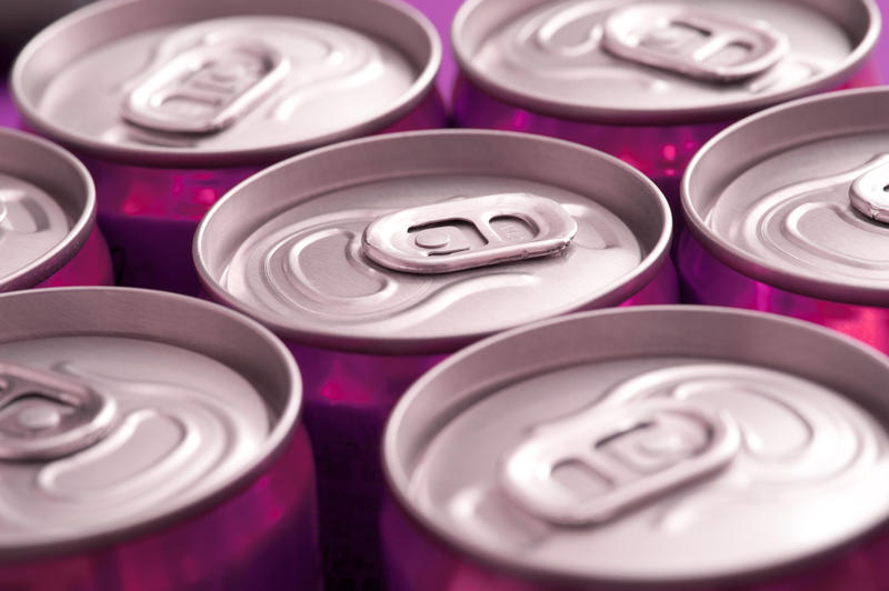 angled view of the tops of unopened drinks cans