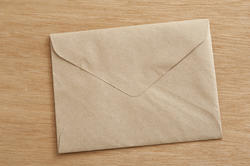 10574   Closed Brown Envelope on Wooden Table
