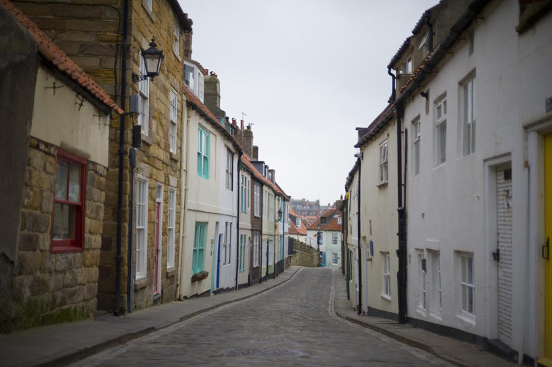 Whitby's narrow Henrietta Street lined with old fishermans cottages, North Yorkshire, UK
