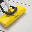 10637   Mopping the tiled floor with a plastic squeegee
