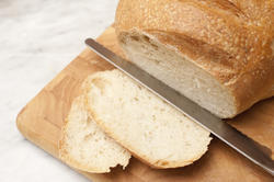 10254   Slicing a loaf of white bread
