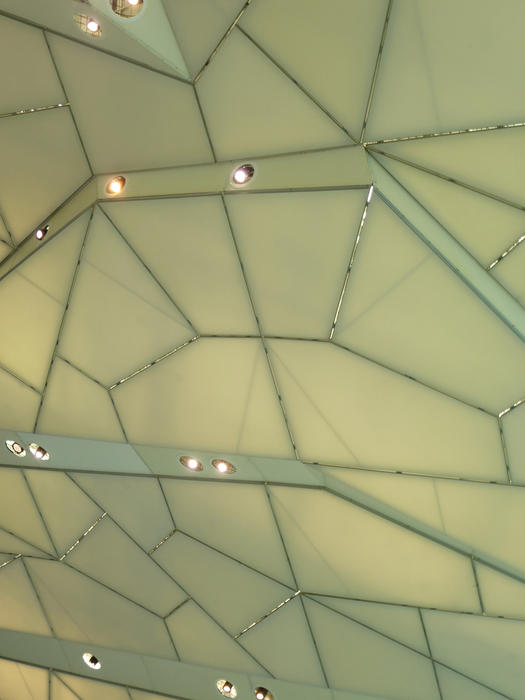 Looking Up at Architectural Detail of Ceiling with Abstract Geometric Pattern and Pot Lighting, Ideal for Backgrounds