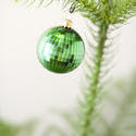 8659   Green Christmas bauble on a tree