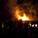 8885   Crowd watching a roaring bonfire on Guy Fawkes