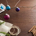 11691   Branch and Christmas Decorations on Table