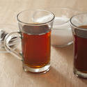 11618   Two glass mugs of hot black tea
