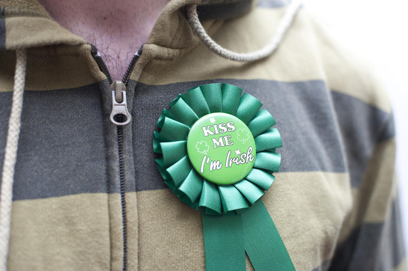 close up on a man wearing a st patricks day kiss me ribbon