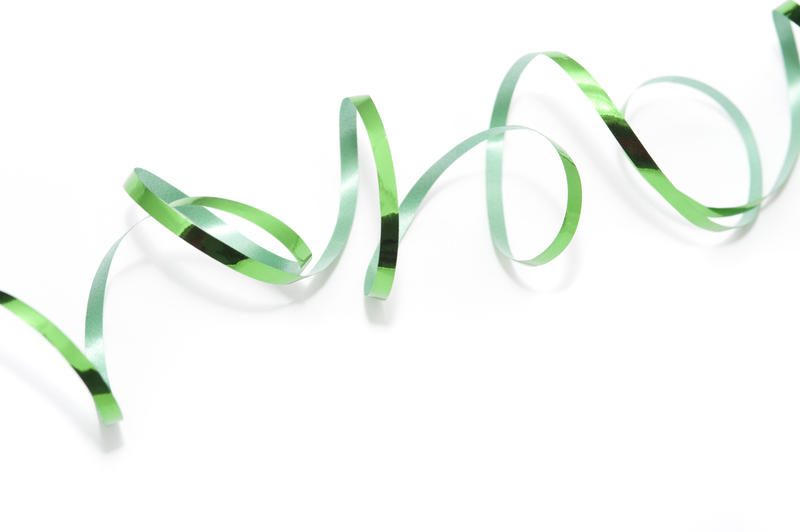 a generic green ribbon background on white could be used for st patricks day or christmas