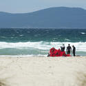 10991   Group of kite surfers on a beach