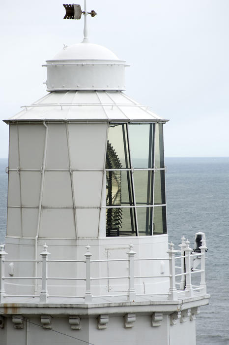 Lantern room with its lamp visible on a lighthouse overlooking the ocean at the Whitby South Lighthouse