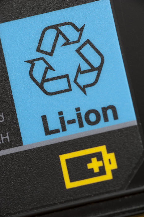 Close Up of Blue Lithium Ion Recycle Label above Yellow Battery Symbol