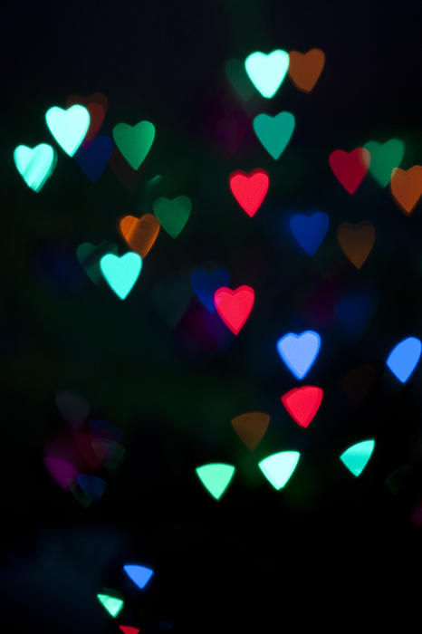 Love Lights Concept - Close up Assorted Colors of Glowing Heart Shape Lights Captured at Night Time.