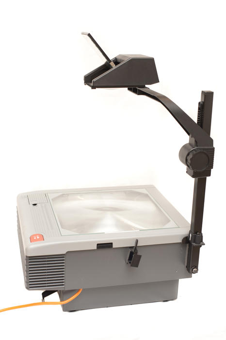 Close up Overhead Projector Device for Presentations in Meeting Room Isolated on White Background.