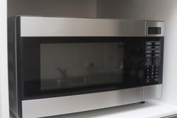 8281   Large microwave in a kitchen