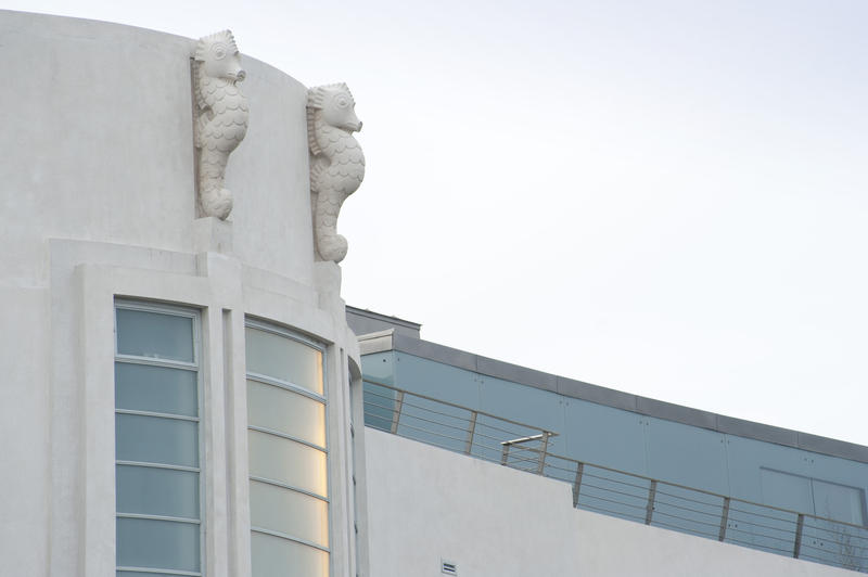 Art Deco details on the curved front facade of the Midland Hotel on the Promenade in Morecambe in the form of two white seahorses