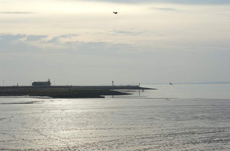 stone pier or jetty at morecame viewed at below tide